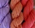 Orchid, orange, rose yarn colors